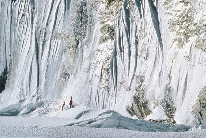 A climber looks tiny in the icefall below the world’s highest mountain.