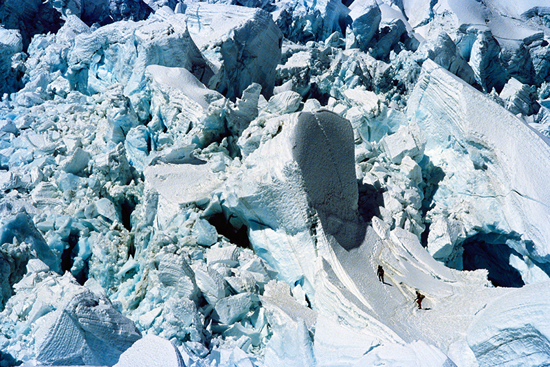 Norwegian climbers negotiate large glacier.